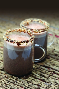 Almond mocha in glass with almond on rim